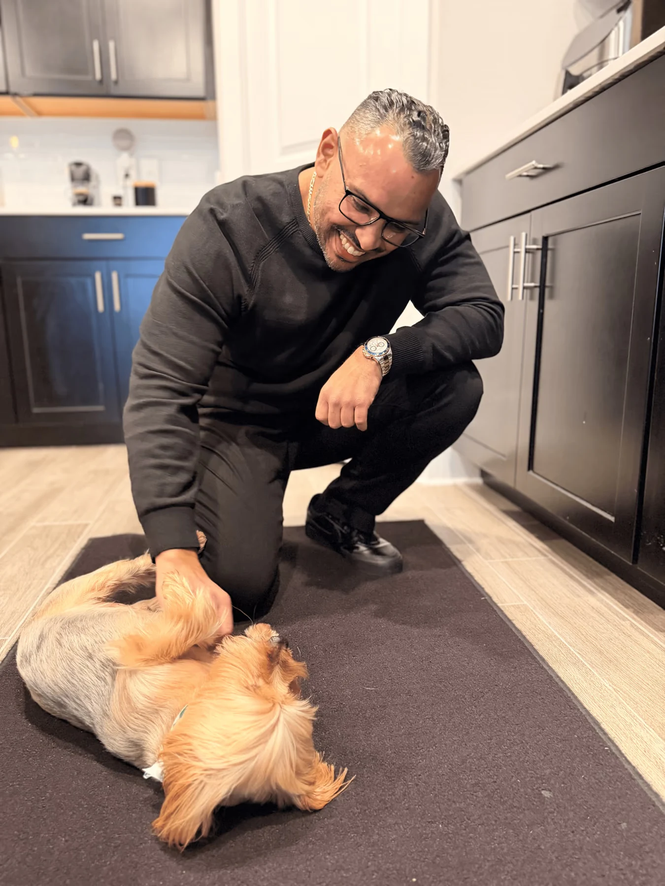 Anardo Cuello at home with his dog